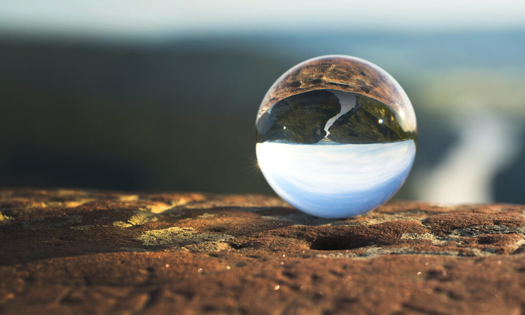 A landscape in a lens who looks like a ball.